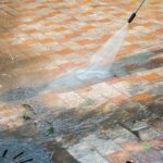 Outdoor floor cleaning with a pressure water jet on street
